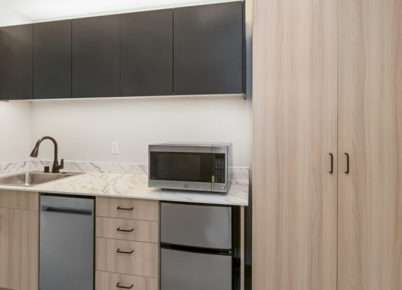 Model kitchen with mini fridge and microwave