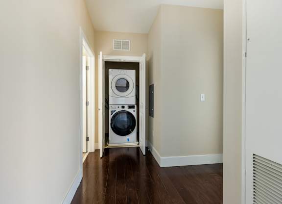 A laundry room with a washer and dryer in it.