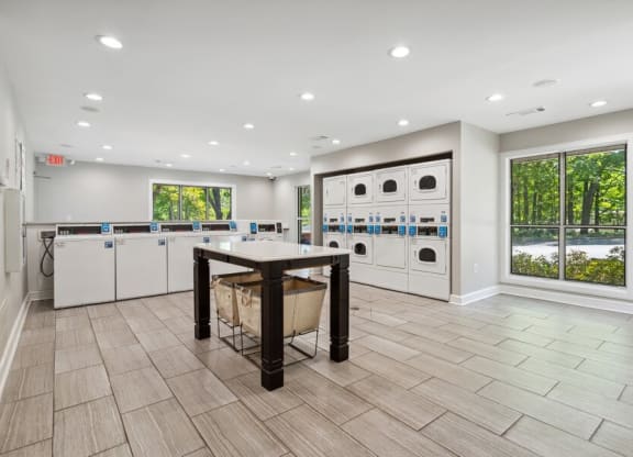 Community Laundry Center with Washing Machines and Dryers at Dunwoody Village Apartments in Atlanta, GA.