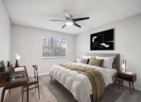 Model Bedroom with Carpet and Window View at Westland Park Apartments in Jacksonville, FL.
