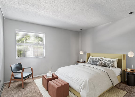Model Bedroom with Carpet and Window View at Corners at 1700 Apartments in Atlanta, GA.