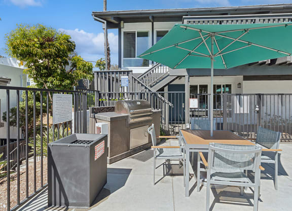 Outdoor BBQ Area with Furniture at Colonnade at Fletcher Hills Apartments in El Cajon, CA.