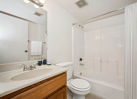 Model Classic Bathroom with Tile Flooring and Shower/Tub at Butler Ridge Apartments located in Glendale, AZ.
