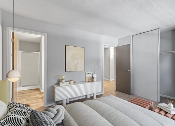 Model Bedroom with Carpet and attached Bathroom at Corners at 1700 Apartments in Atlanta, GA.
