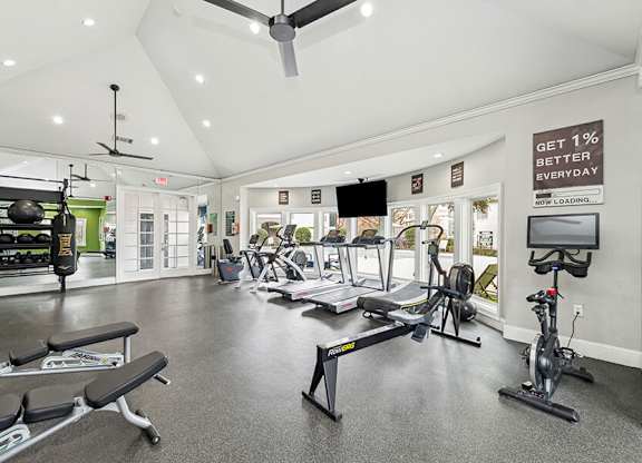 Community Fitness Center with Equipment at Bridges at Oakbend Apartments located in Lewisville, TX.