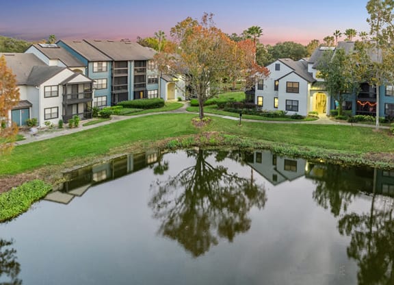 Aerial View of Community Pond and Exterior Building at Fountains at Lee Vista Apartments in Orlando, FL.