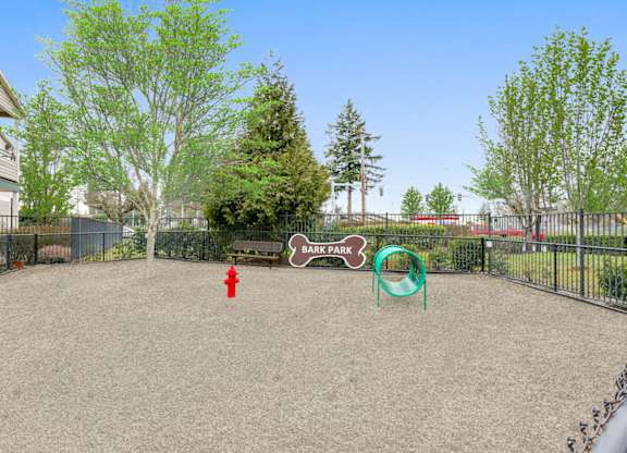 Community Dog Park with Agility Equipment at Landings at Morrison Apartments located in Gresham, OR.