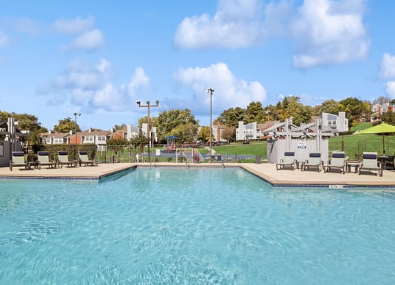 Community Swimming Pool with Pool Furniture at Abbington Heights Apartments in Antioch, TN.
