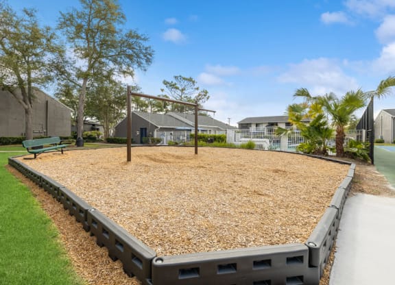 Community swing set with bench