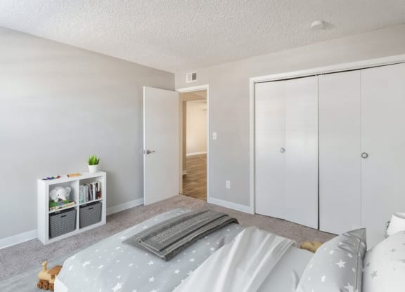Model Bedroom with Carpet at Indigo Park Apartments in Albuquerque, NM.