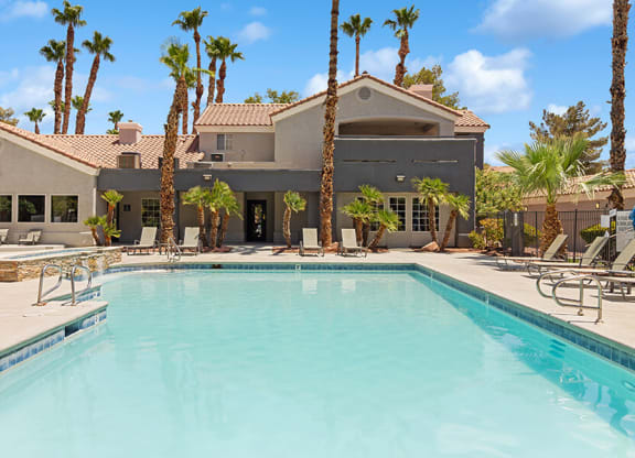 Community Swimming Pool with Pool Furniture at Verraso Apartments in Las Vegas, NV.