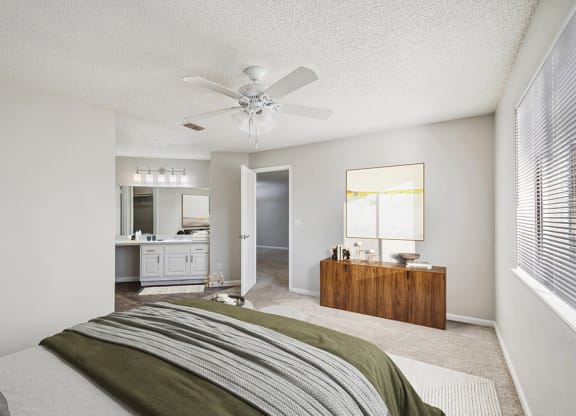 Model Bedroom with Carpet and attached Bathroom at Westland Park Apartments in Jacksonville, FL.