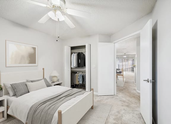 Model Bedroom with Carpet and Closet at Westland Park Apartments in Jacksonville, FL.