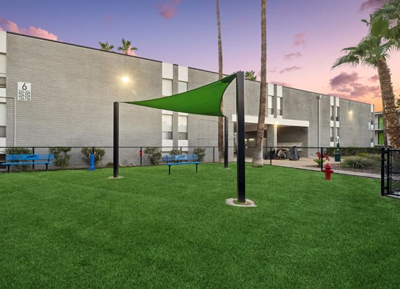 Community Dog Park with Benches and Canopy at Arcadia on 49th Apartments located in Phoenix, AZ.