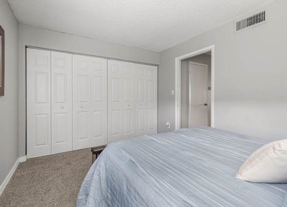 Model bedroom at Oasis at Bayside Apartments in Largo, FL