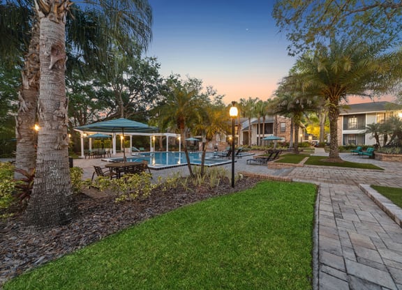 Community Swimming Pool and Landscape at Grand Pavilion Apartments in Tampa, FL.