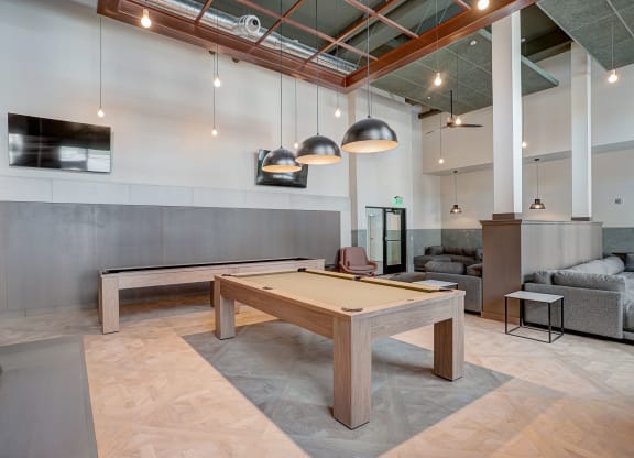 pool table in clubhouse at the district flats apartments in lenexa