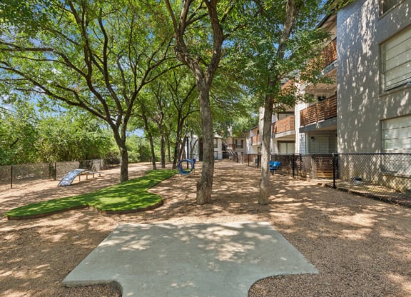 Community Dog Park with Agility Equipment at Woodcreek Apartments located in Arlington, TX.
