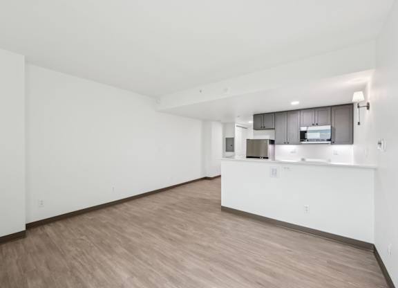 A kitchen area with a countertop and cabinets.