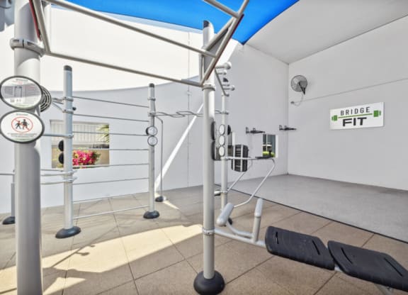 a workout room with weights and ropes in a gym