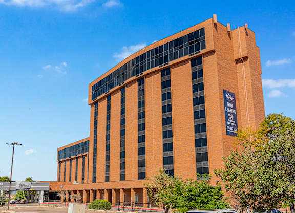 A large orange building with a sign that reads