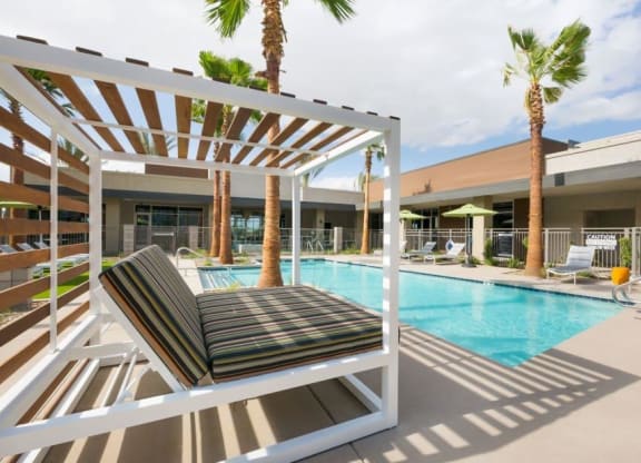 Cabana bed next to swimming pool
