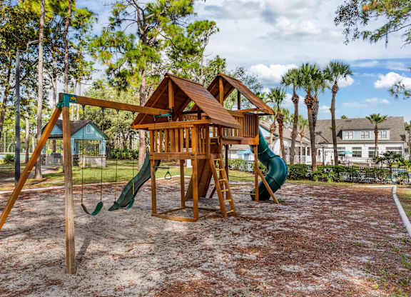 Community wooden playground with swings and slides at Mirage on Kernan in Jacksonville, Florida.