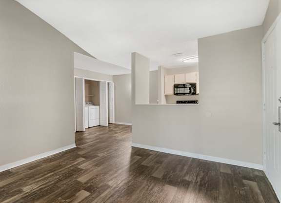 Model living room with hard wood vinyl flooring at Mirage on Kernan in Jacksonville, Florida.