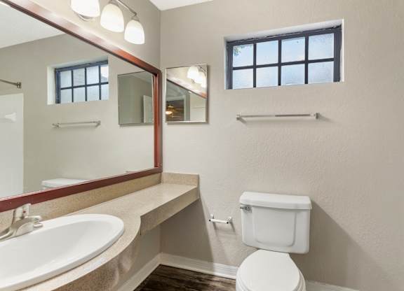 Model bathroom with vanity and toilet at Mirage on Kernan in Jacksonville, Florida.