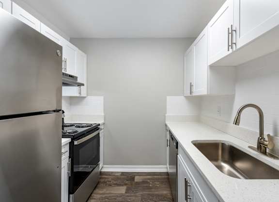 Model kitchen with appliances at Oasis at Bayside in Largo, FL.