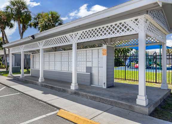 Community white pergola with lattice work at Park at 7200 in Jacksonville, Florida.