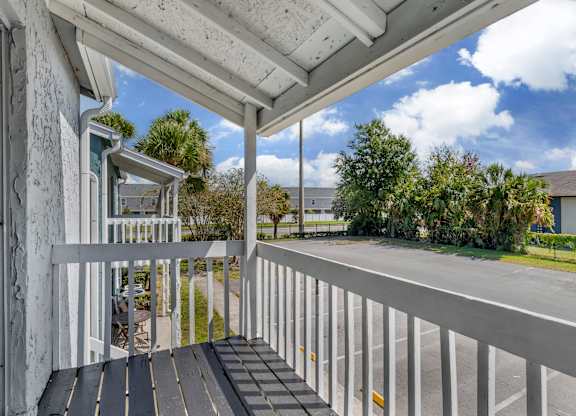 Model personal patio overlooking the community parking lot at Park at 7200 in Jacksonville, Florida.