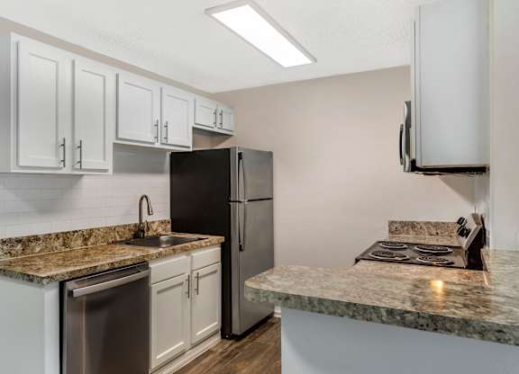 Model kitchen with modern appliances at Park at 7200 in Jacksonville, Florida.