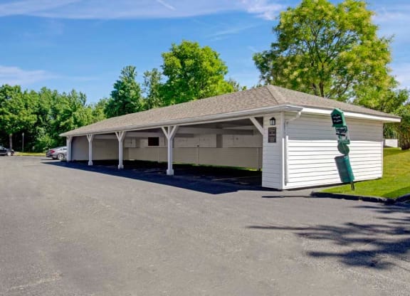 a white building with a parking lot in front of it