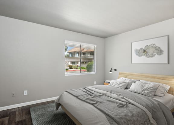 a bedroom with a bed and a window