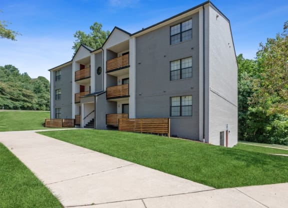 Apartment building exterior with lush greenery