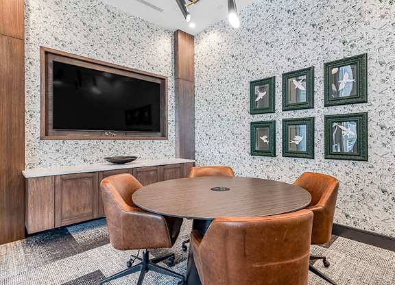 Community Clubhouse Meeting Room at Ovation at Galatyn Park Apartments located in Richardson, TX.