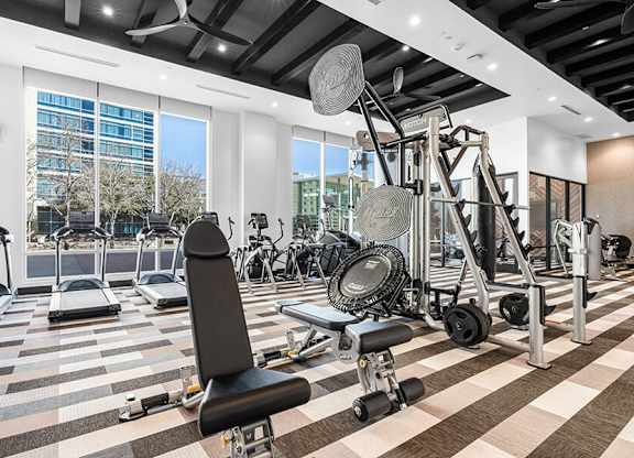 Community Fitness Center with Equipment at Ovation at Galatyn Park Apartments located in Richardson, TX.