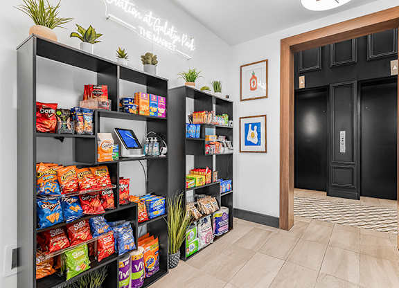 Community Market Store at Ovation at Galatyn Park Apartments located in Richardson, TX.