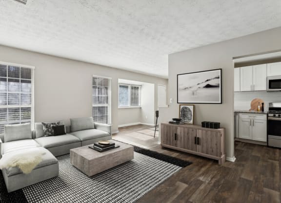 Model apartment living room with a couch and a coffee table