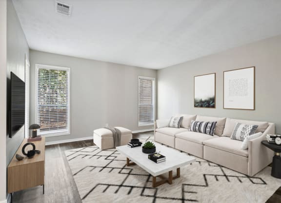 Model living room of an apartment with a couch and a coffee table