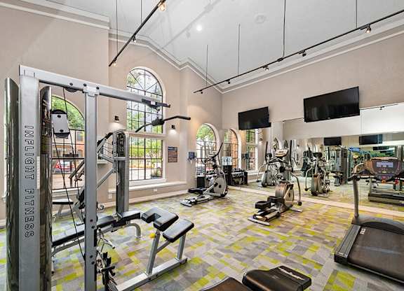 Community Fitness Center with Equipment at Dallas North Park Apartments in Dallas, TX.