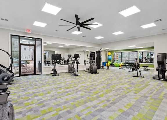 Community Fitness Center with Equipment and Mirrors at Element 41 Apartments in Marietta, GA.