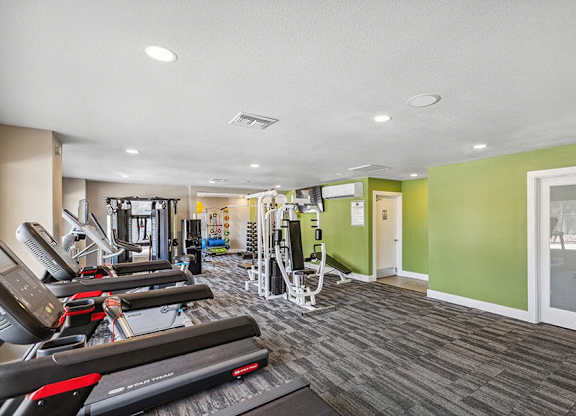 Community Fitness Center with Equipment at Saddle Ridge Apartments in Tucson, AZ.