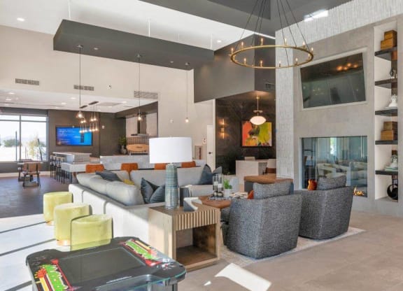 Resident lounge with large fireplace at Glen 91 Apartments in Glendale, AZ