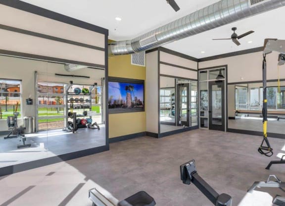 Fitness center with equipment at Glen 91 Apartments in Glendale, AZ