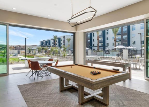 Resident lounge space with billiards table at Glen 91 Apartments in Glendale, AZ
