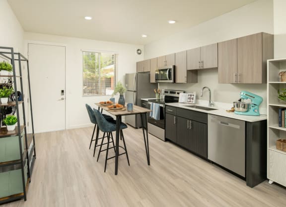 a kitchen and dining area in a 555 waverly unit