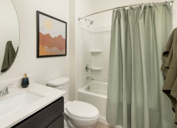 a bathroom with a sink toilet and bathtub