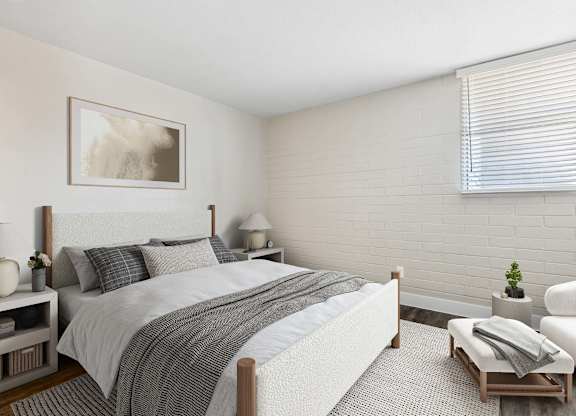 One-Bedroom Apartments in Camelback East Village, AZ - Arcadia on 49th - A Bright Bedroom With A White Upholstered Bed, Neutral Bedding, Side Tables With Lamps, And A Large Window.